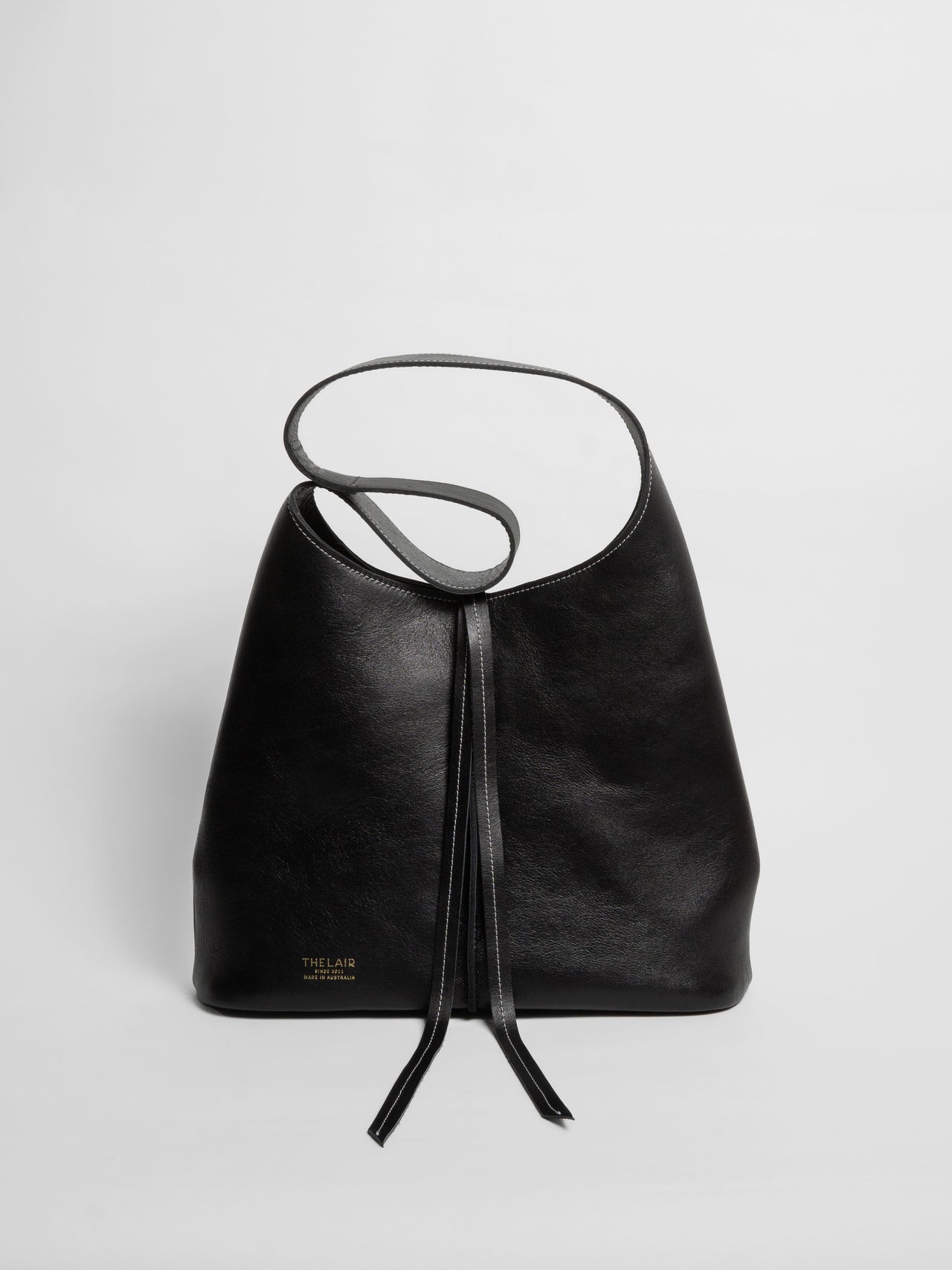 The Lair Suedo Sling Bag Small Black Gold
